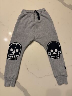 nununu Gray Joggers with Black Skull Patches